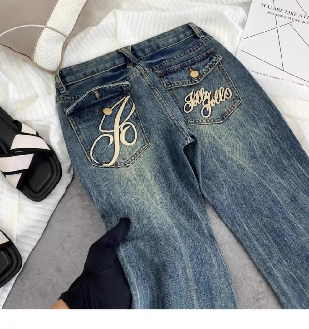 Vaqueros retro americanos de cintura baja para mujer, novedad de otoño, bordado, moda informal antigua, temperamento, pantalones ajustados con campana del Joker.