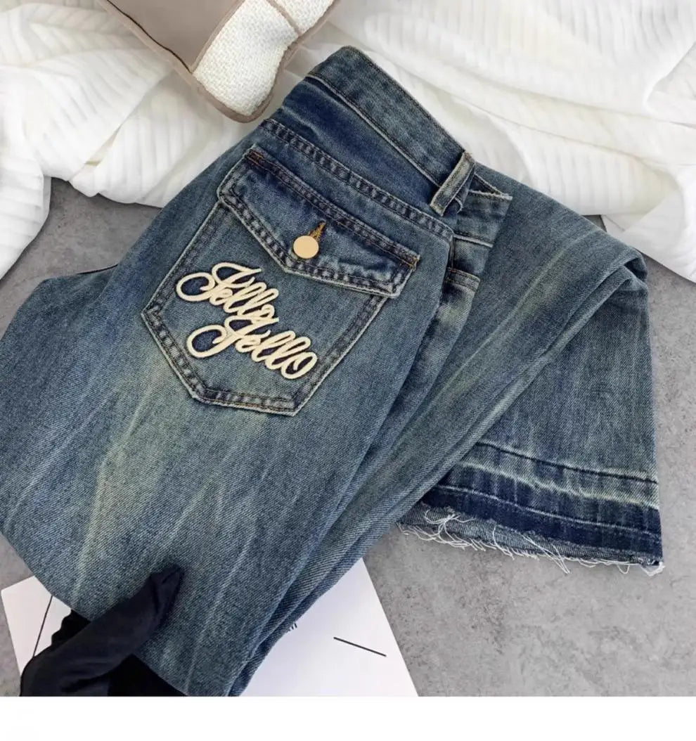 Vaqueros retro americanos de cintura baja para mujer, novedad de otoño, bordado, moda informal antigua, temperamento, pantalones ajustados con campana del Joker.