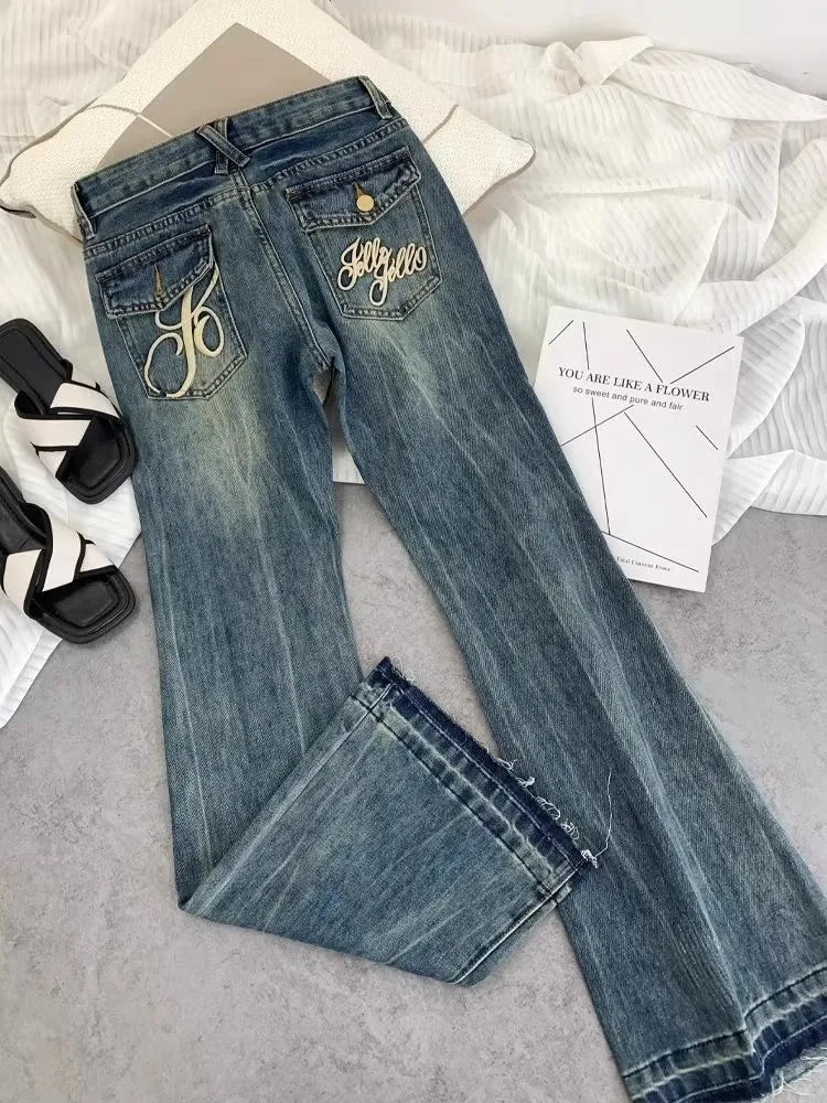 Vaqueros retro americanos de cintura baja para mujer, novedad de otoño, bordado, moda informal antigua, temperamento, pantalones ajustados con campana del Joker.