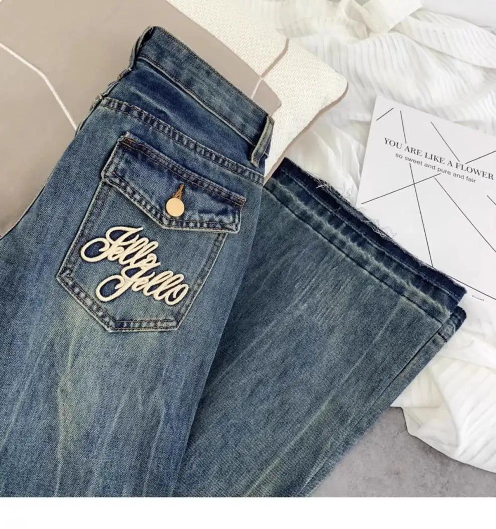 Vaqueros retro americanos de cintura baja para mujer, novedad de otoño, bordado, moda informal antigua, temperamento, pantalones ajustados con campana del Joker.