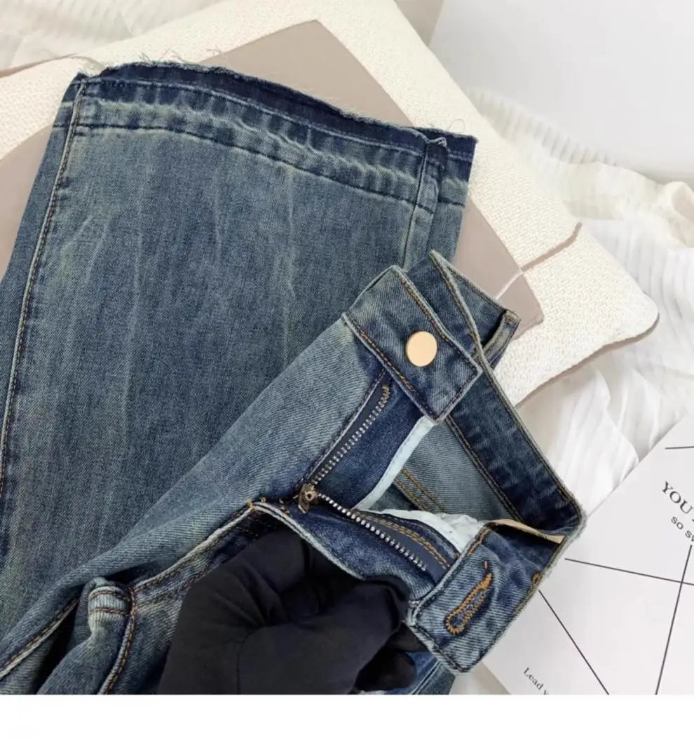 Vaqueros retro americanos de cintura baja para mujer, novedad de otoño, bordado, moda informal antigua, temperamento, pantalones ajustados con campana del Joker.