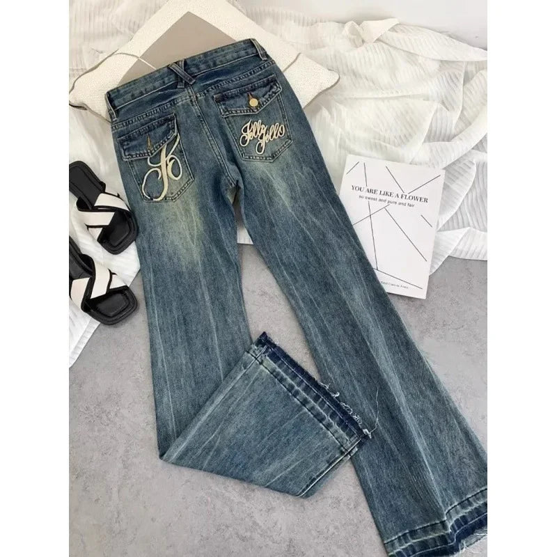 Vaqueros retro americanos de cintura baja para mujer, novedad de otoño, bordado, moda informal antigua, temperamento, pantalones ajustados con campana del Joker.