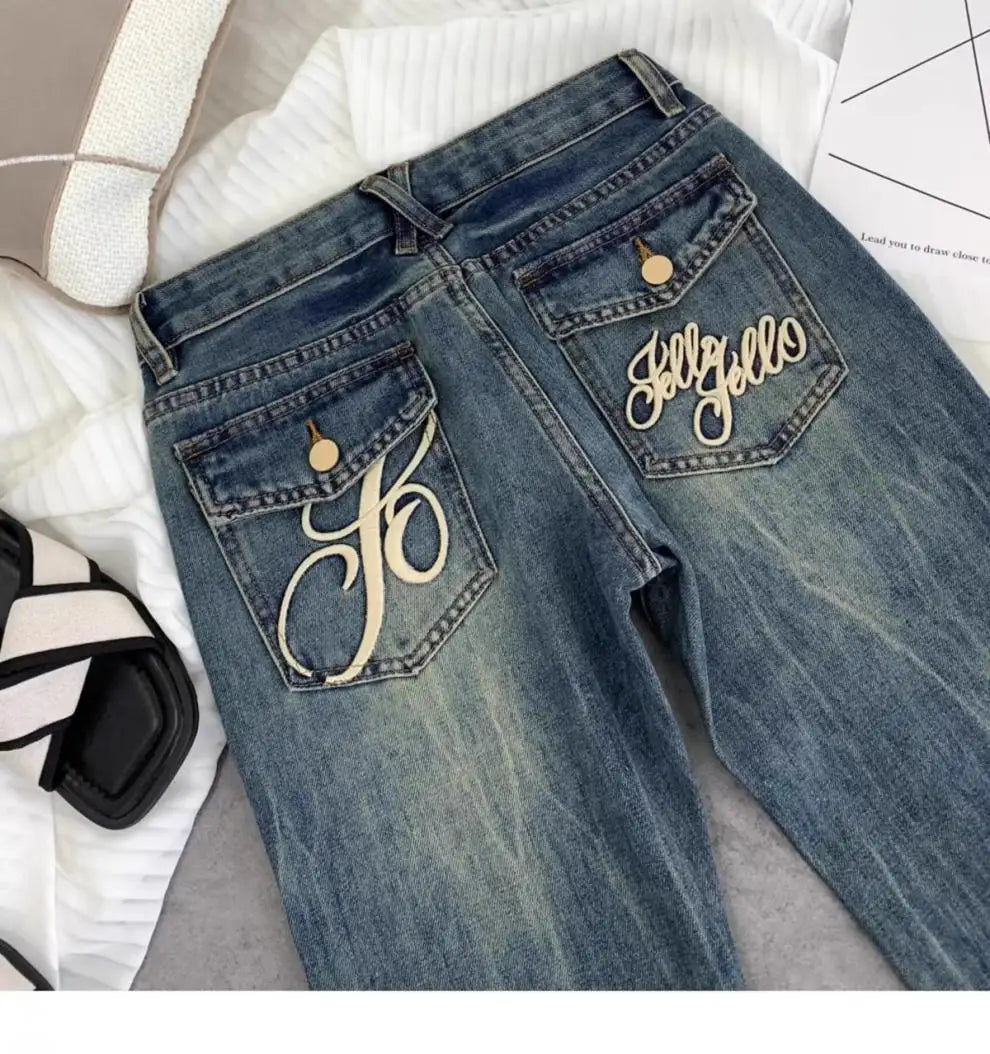 Vaqueros retro americanos de cintura baja para mujer, novedad de otoño, bordado, moda informal antigua, temperamento, pantalones ajustados con campana del Joker.