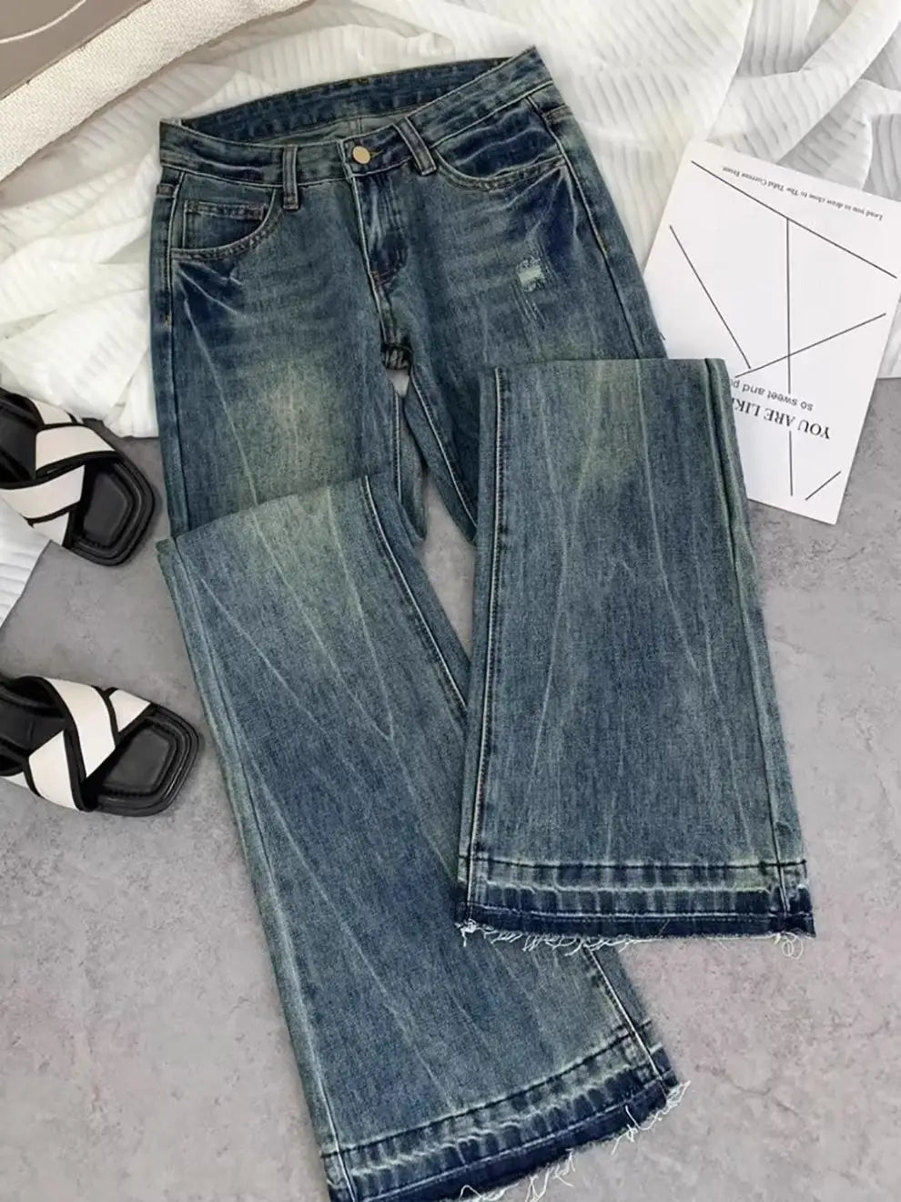 Vaqueros retro americanos de cintura baja para mujer, novedad de otoño, bordado, moda informal antigua, temperamento, pantalones ajustados con campana del Joker.